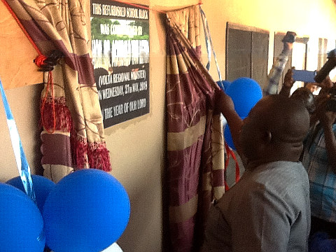 Unveiling the plaque marking the Volta regional government's role in the reopening of Dagbamete's primary school block